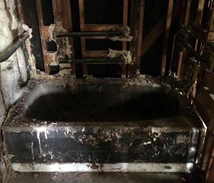 fire damaged bathroom covered in soot